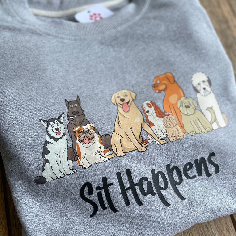 Sit Happens - Cute athletic grey sweatshirt with an array of different dog breeds sitting. Below the dogs, is Sit Happens.
