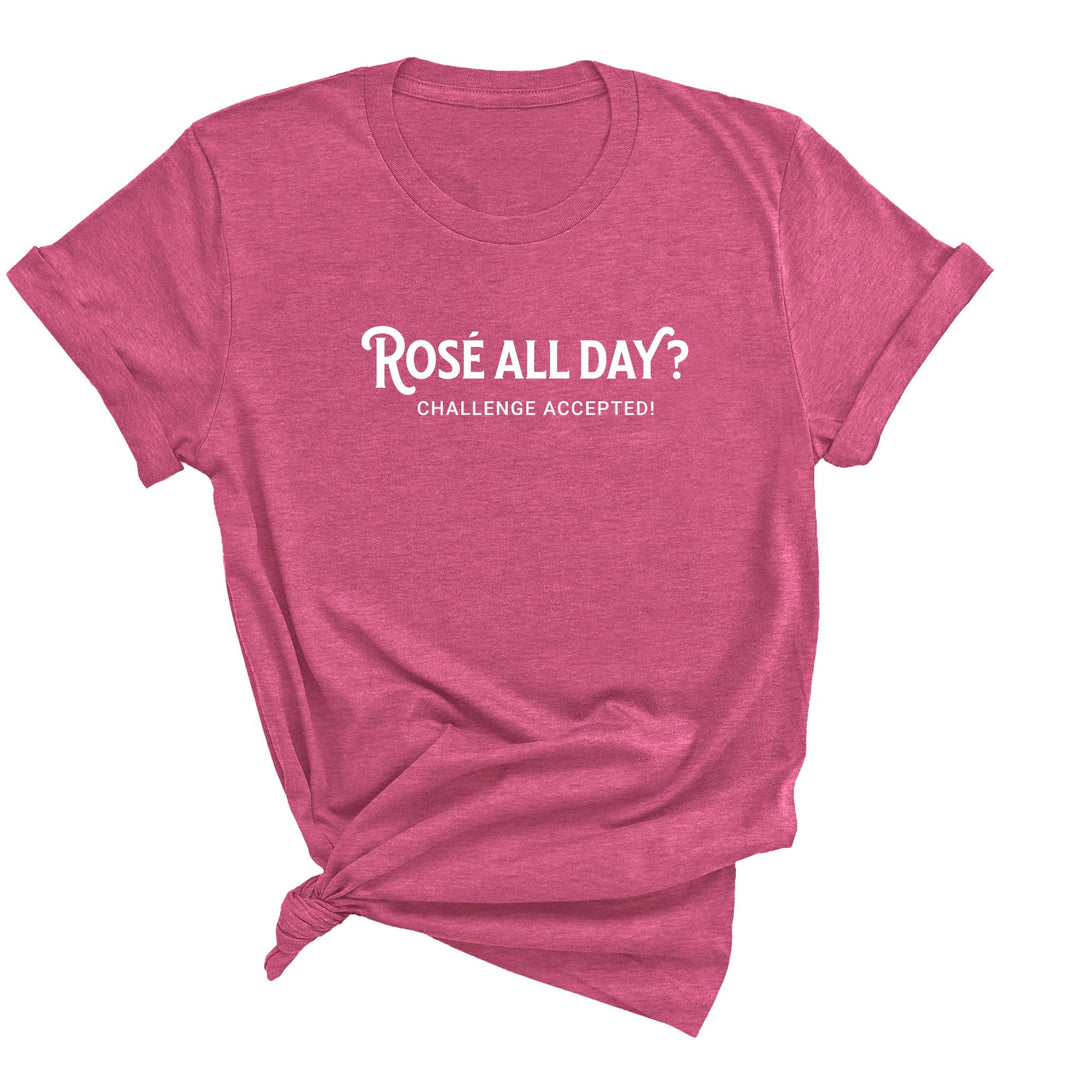 Image of a Heather Raspberry unisex shirt featuring the playful phrase 'Rose All Day' in a simple font, perfect for wine lovers. The shirt exudes a sense of fun and style.