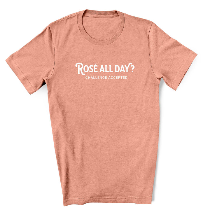 Image of a Heather Sunset unisex shirt featuring the playful phrase 'Rose All Day' in a simple font, perfect for summer fun and day drinking events. The shirt exudes a sense of fun and style for any rose wine drinkers.
